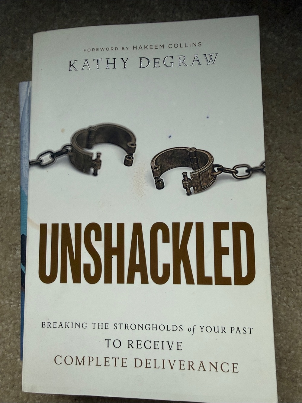 Unshackled Hardcover Book - White/Brown Cover